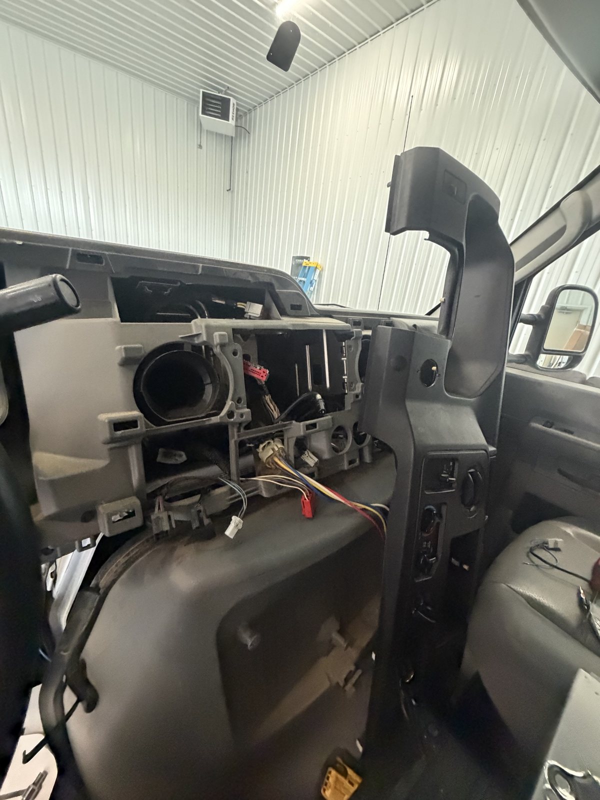 Ford E-350 dash torn apart mid-install with wiring exposed